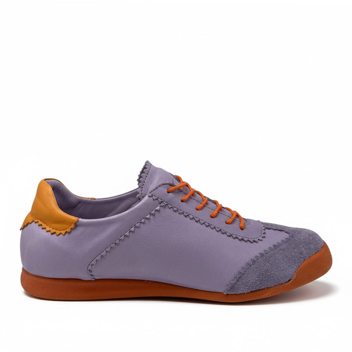 Purple sneaker with orange accents
