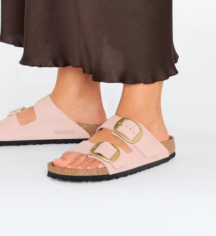 House of Florian Arizona Big Buckle sandals in soft pink nubuck leather with oversized gold buckles on feet