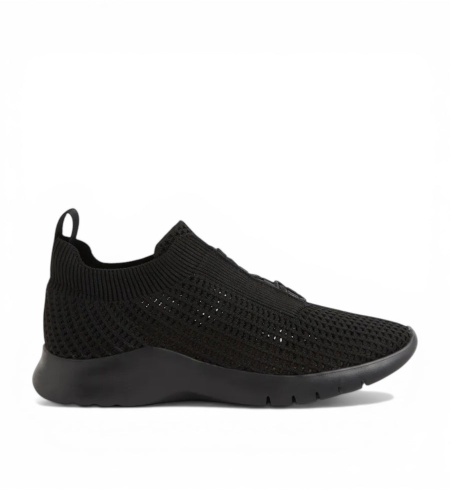 House of Florian Prisse XW black knit slip-on sneakers with a textured sole and pull tab.