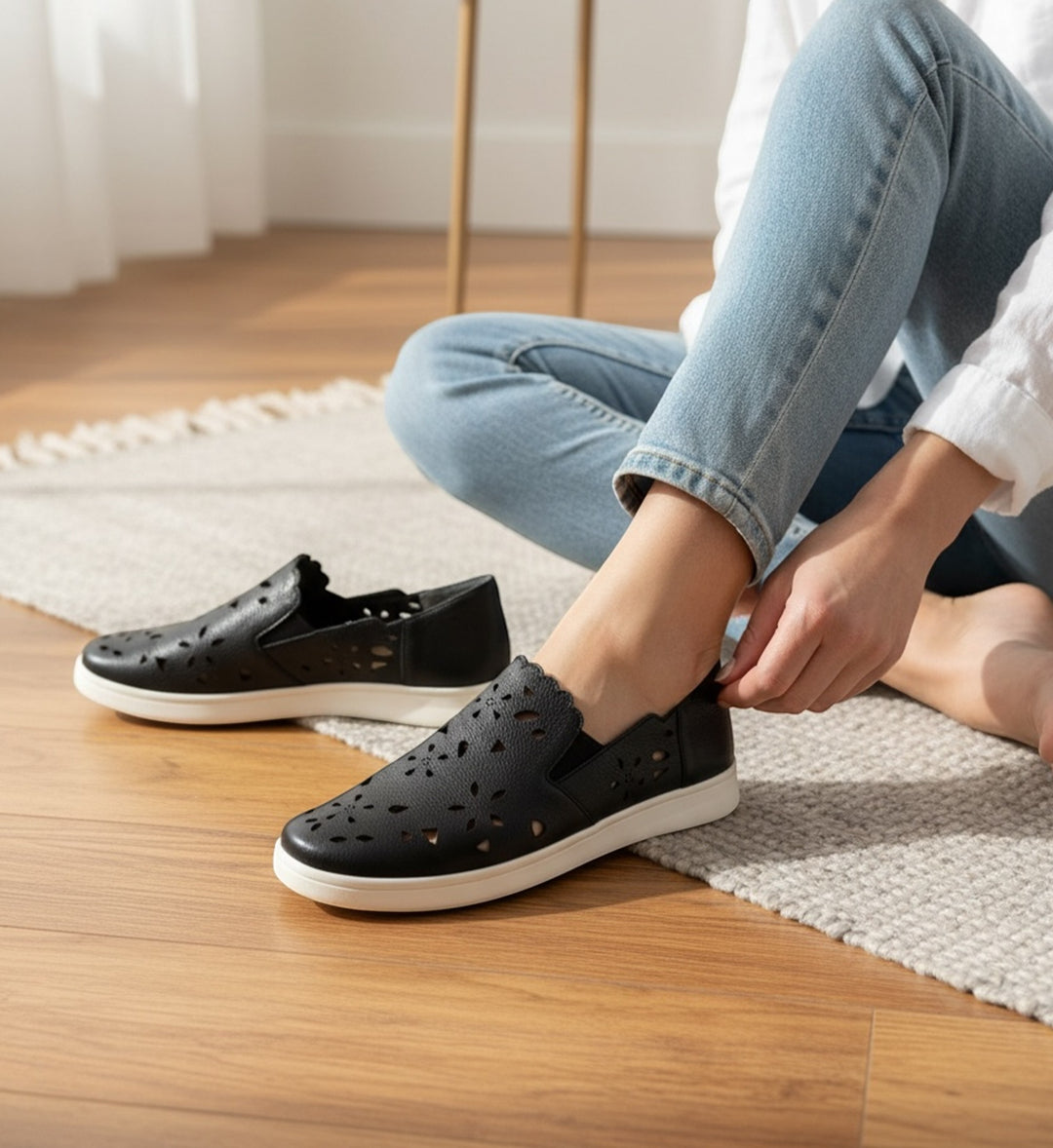 House of Florian Deljis XF black leather slip-on shoes with floral cut-outs and scalloped trim.
