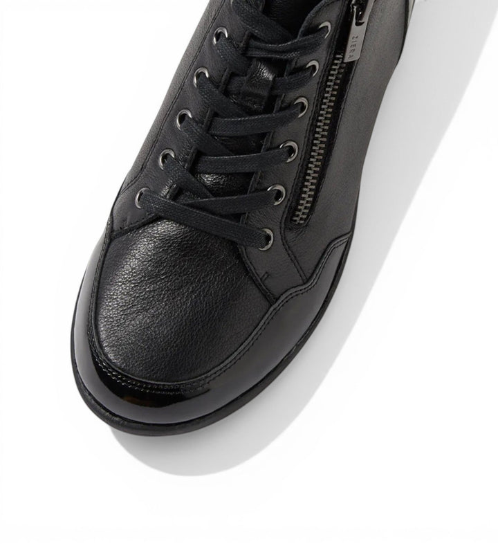 House of Florian Neonne W Black leather sneakers with lace-up front and side zipper detail.