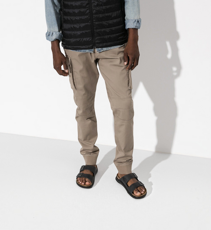 House of Florian model wearing black oiled leather Birkenstock Milano sandals with adjustable straps and cork footbed