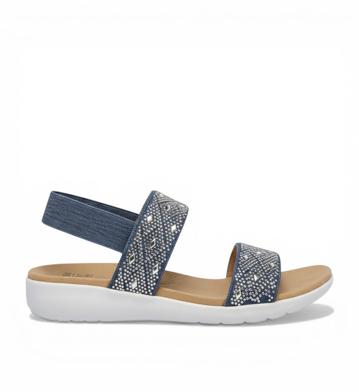 House of Florian Usaid W Blue Denim sandals with elastic straps adorned with rhinestones and a white sole.