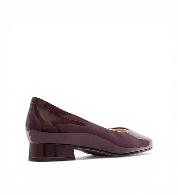 House of Florian Cleo burgundy patent leather square-toe block heel pumps.