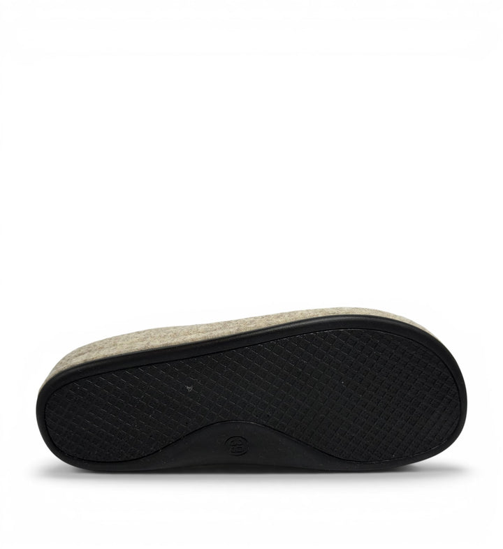 House of Florian Dash slipper showing the textured black rubber sole and grey felt upper from a bottom angle view.