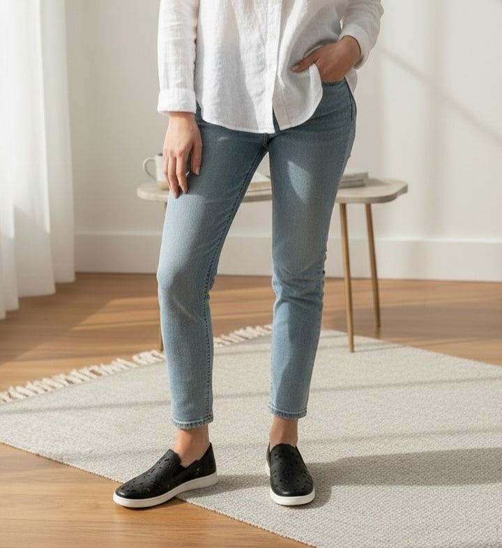 House of Florian Deljis XF black perforated leather slip-on shoes with white soles.