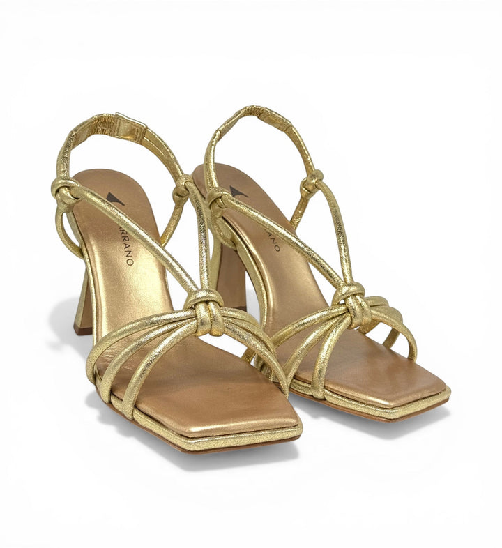 House of Florian gold metallic strappy square-toe heeled sandals with knot detail.