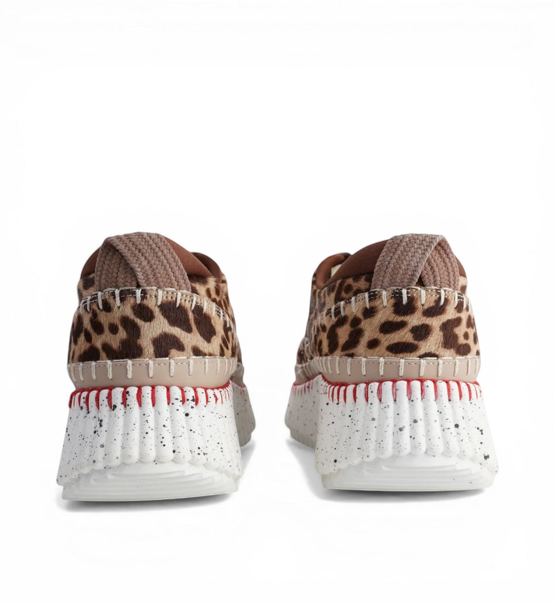 House of Florian Copen Leopard platform sneakers with faux fur leopard print and white speckled soles with red stitching.