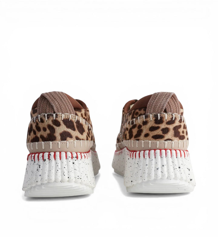 House of Florian Copen Leopard platform sneakers with faux fur leopard print and white speckled soles with red stitching.