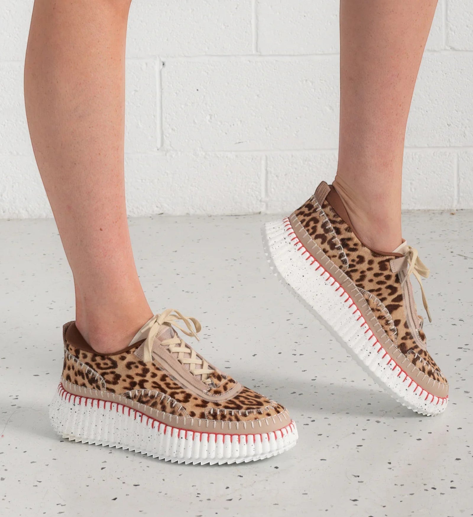 House of Florian Copen Leopard print sneakers with beige laces and a white platform sole with red stitching.