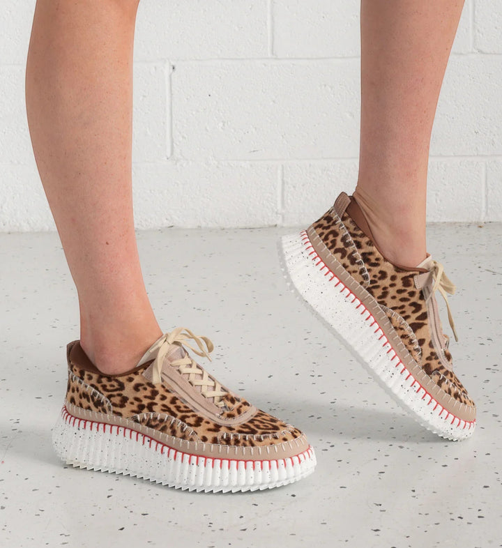 House of Florian Copen Leopard print sneakers with beige laces and a white platform sole with red stitching.
