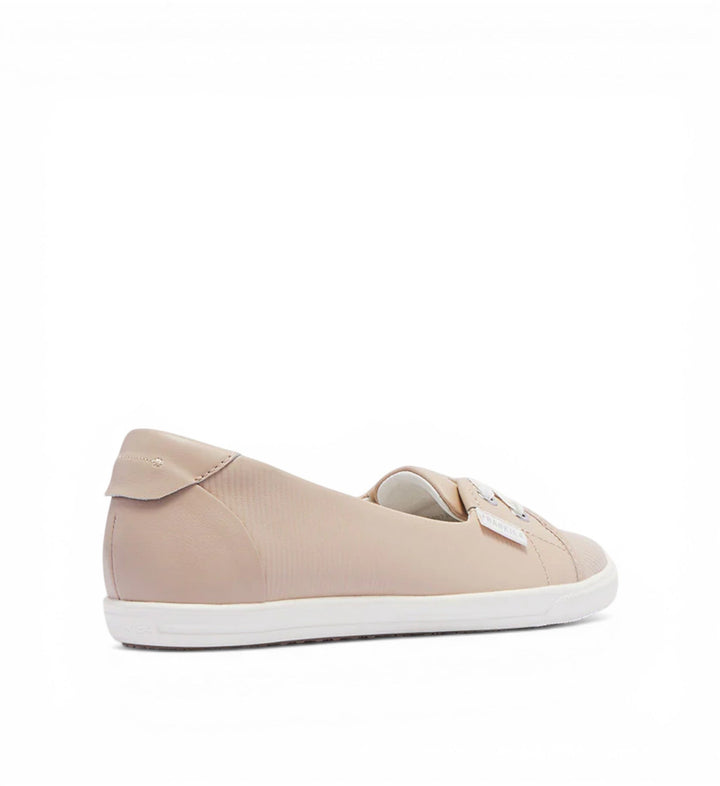 House of Florian Hannah III light blush embossed leather slip-on sneakers with white sole and subtle bow detail.