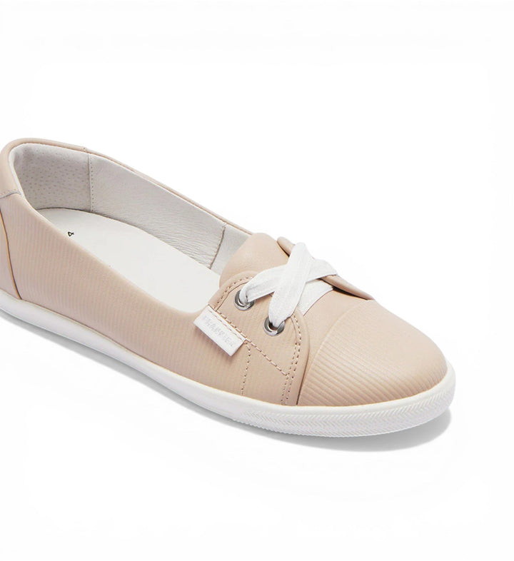 House of Florian Hannah III light blush embossed leather slip-on sneakers with white laces and white soles.