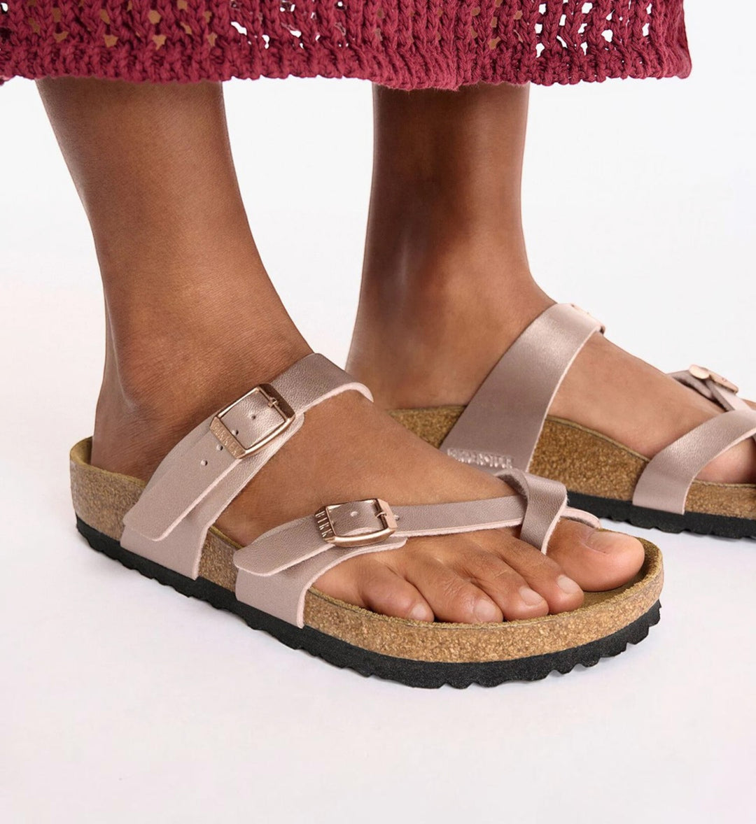 House of Florian Mayari copper Birko-Flor sandals with toe loop and adjustable buckles on feet.