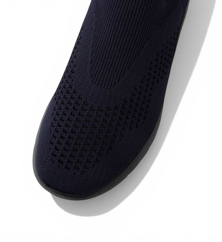 House of Florian navy knit slip-on shoe with perforated detailing and a flexible sole.