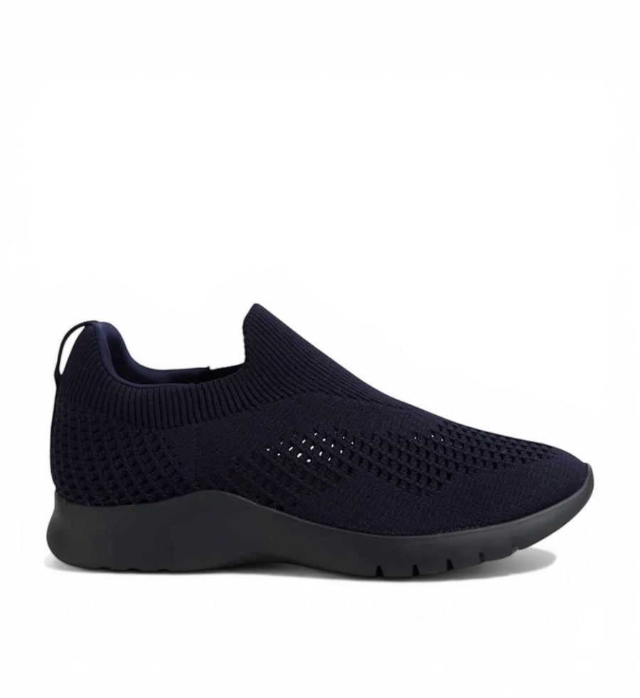 ZIERA navy knit slip-on sneakers with a textured pattern and black sole.