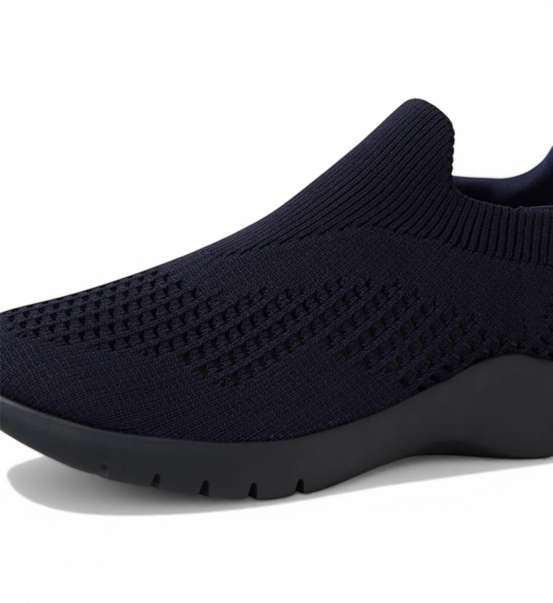 House of Florian navy knit slip-on sneakers with perforated detailing and a flexible sole.