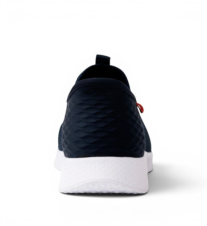 House of Florian navy blue slip-on sneakers with textured heel and white sole.