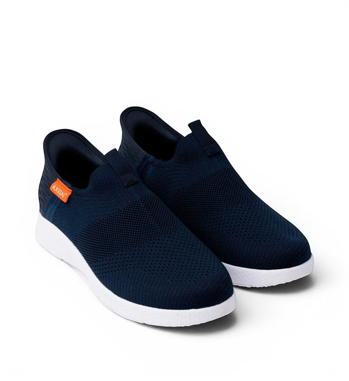 House of Florian navy blue knit slip-on sneakers with white soles and orange logo tag.