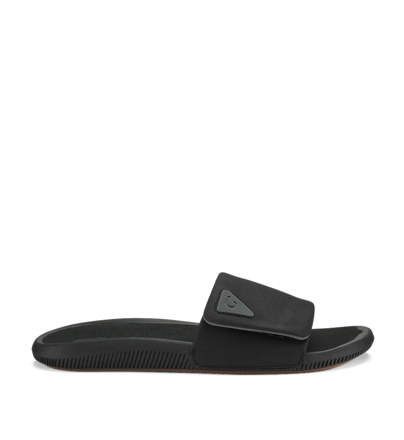 House of Florian Olukai Ulele Lanai Lava Rock black slide sandal with adjustable strap and textured sole.