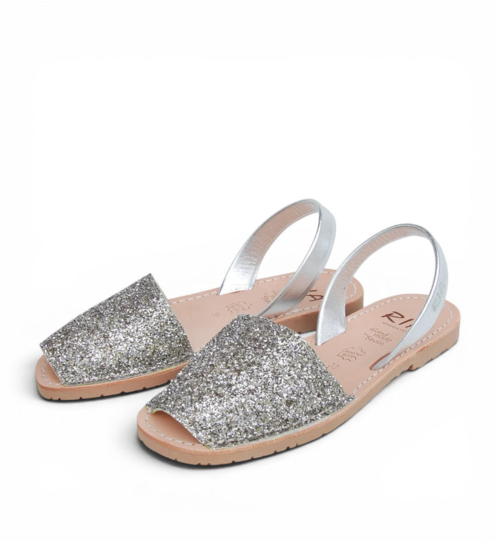 House of Florian Joan Avarcas Glitter Sandals in pewter with silver straps and open toe.