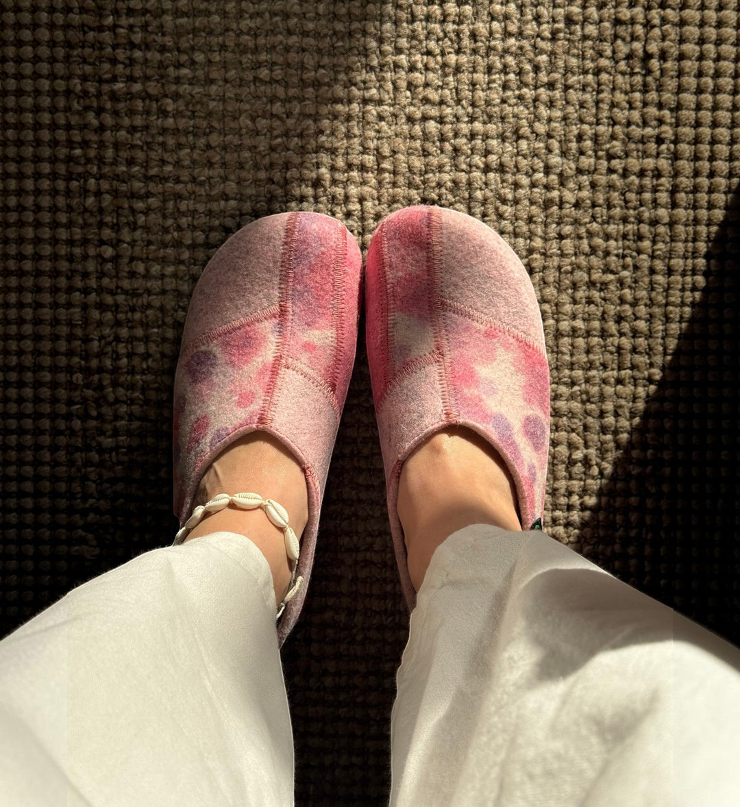 House of Florian Hilda pink bubble felt slippers with a tie-dye pattern worn on feet over a textured carpet
