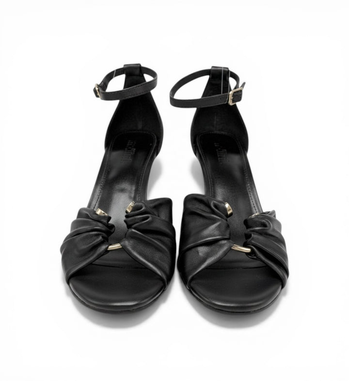 House of Florian Posy Black leather sandals with ankle strap and ruched toe detail with gold hardware.