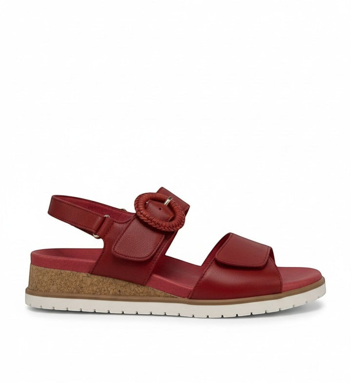 House of Florian red leather sandals with adjustable straps, cork sole, and decorative buckle.