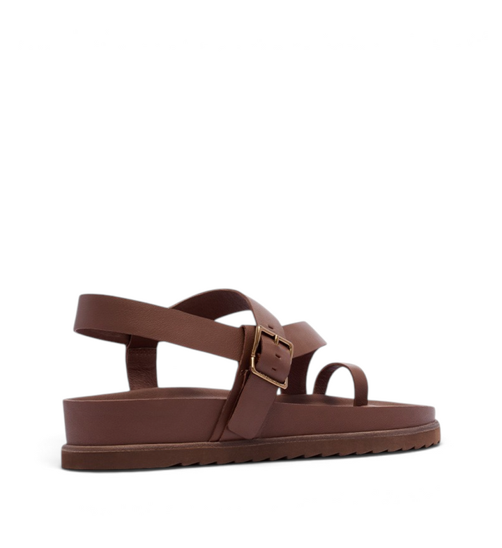 House of Florian Ren Cinnamon leather toe-loop sandals with an adjustable buckle strap and a flat platform sole.
