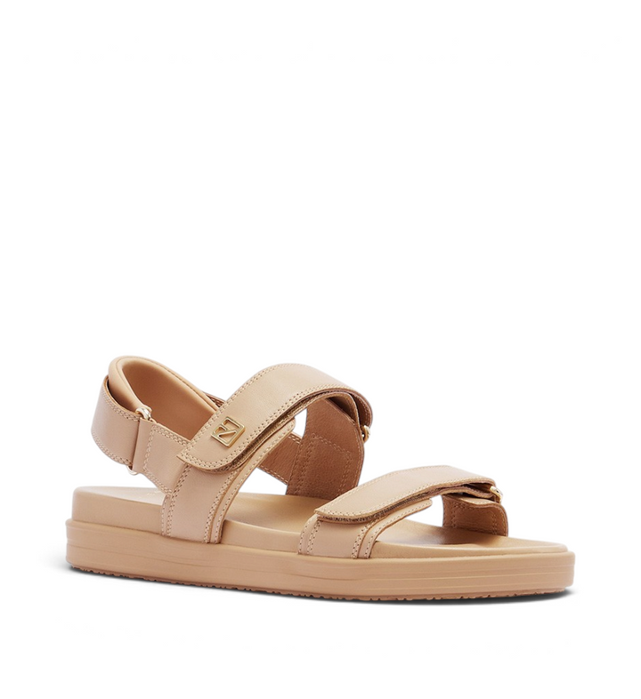 House of Florian Rome Camel flat sandals in beige leather with adjustable velcro straps and gold logo hardware.