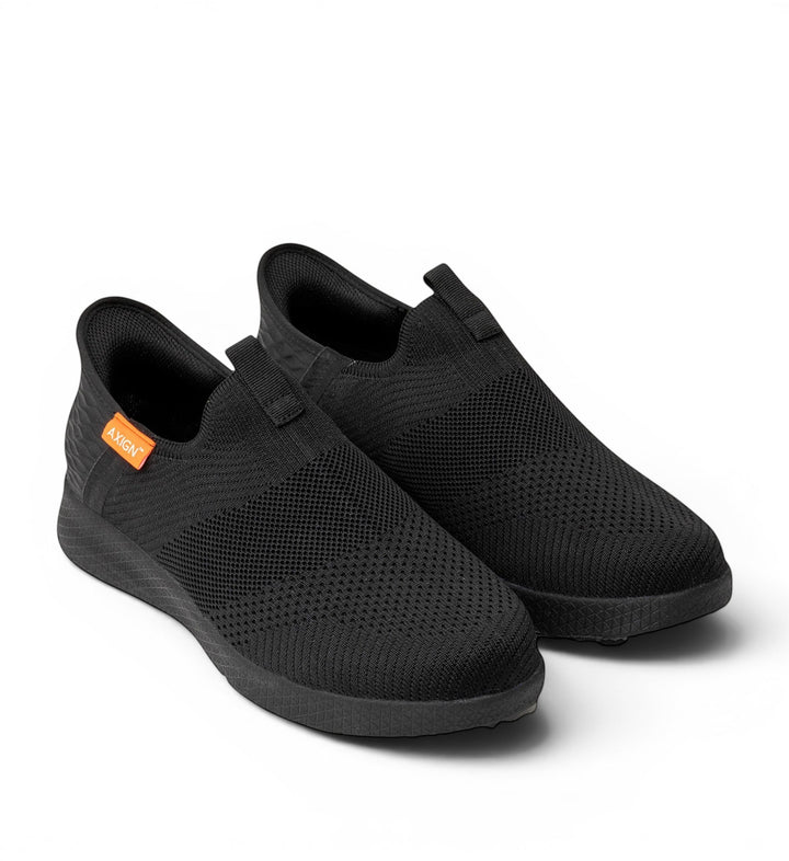 House of Florian Slipstream lightweight black knit slip-on sneakers with elastic side panels and pull tabs.