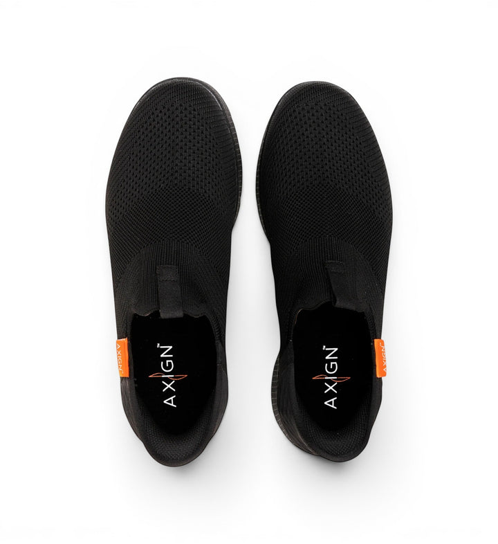 House of Florian Slipstream Lightweight Slip-On shoes in black knit fabric with a flexible sole and orange accent tag.