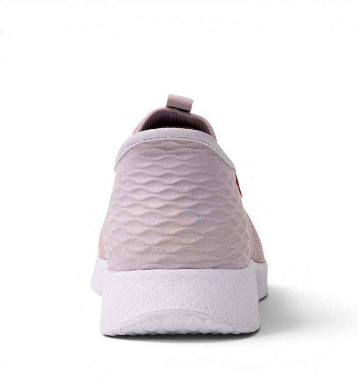 House of Florian Slipstream Lightweight Slip-On in pink with textured wave pattern on heel and white sole.