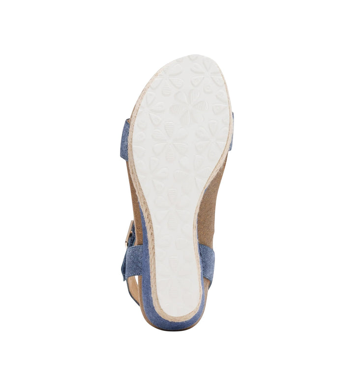 House of Florian Sydney Denim wedge sandal featuring a blue denim upper and a white floral patterned rubber sole.