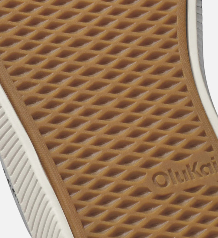 House of Florian Ulele Ash/Ash sneakers with a tan rubber sole featuring a diamond tread pattern and Olukai branding.