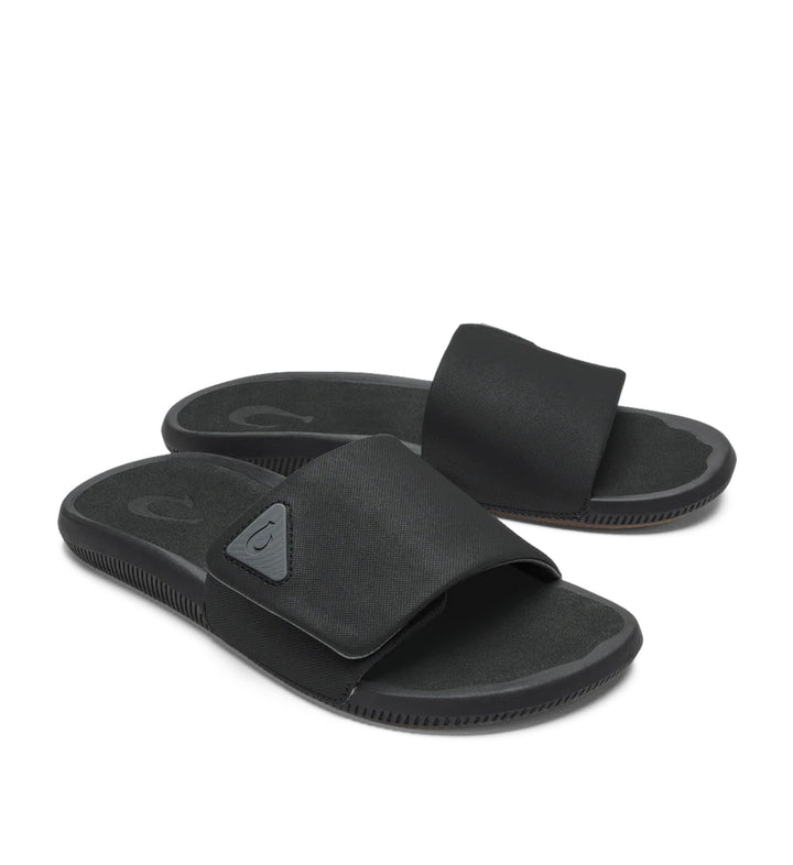 House of Florian Ulele Lanai Lava Rock black slide sandals with adjustable strap and textured footbed.