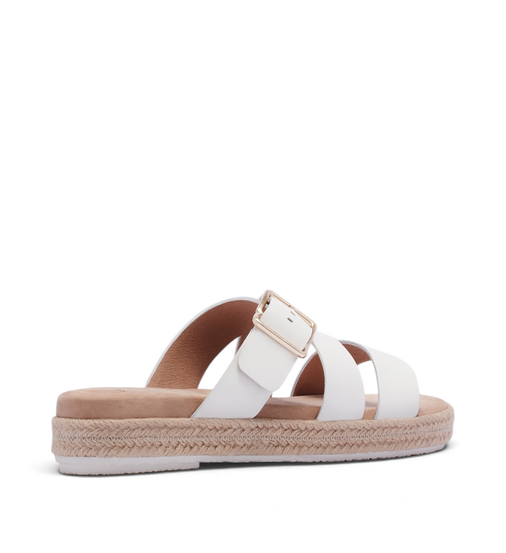 House of Florian Micah soft white slide sandals featuring a jute espadrille platform sole and gold buckle detail.