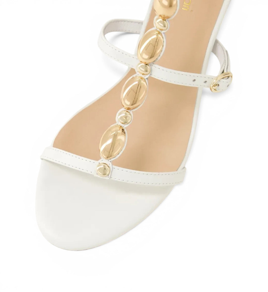 House of Florian Glimery White sandal featuring a white leather strap with decorative gold-tone metallic beads