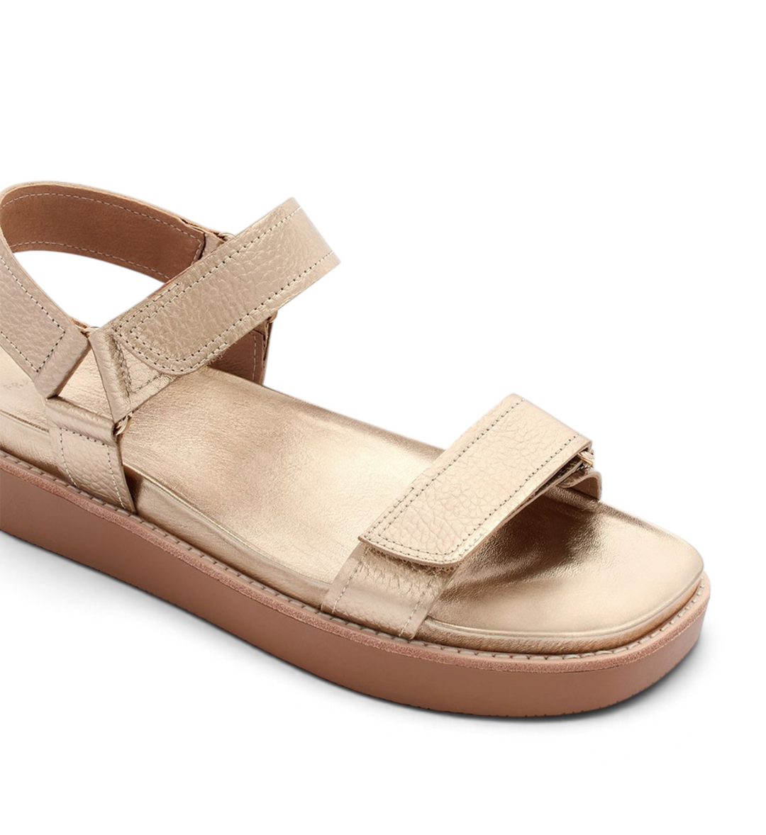 House of Florian Zane soft gold tumbled leather sandal with adjustable velcro straps and a thick brown platform sole.